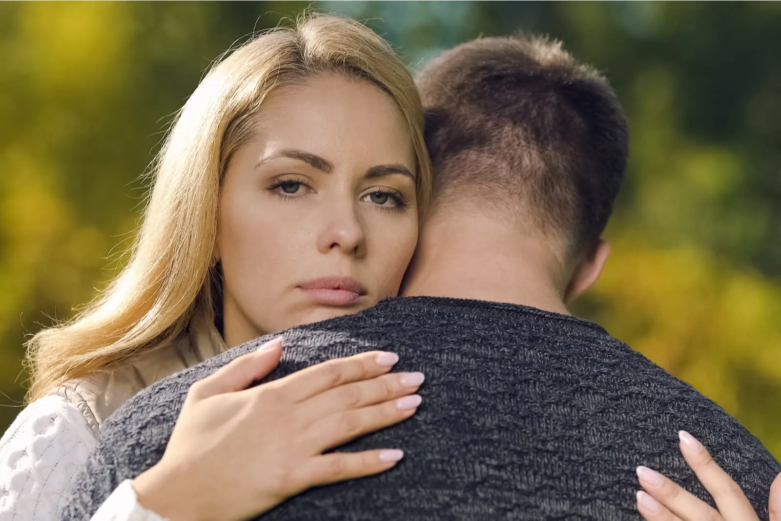 Upset couple hugging