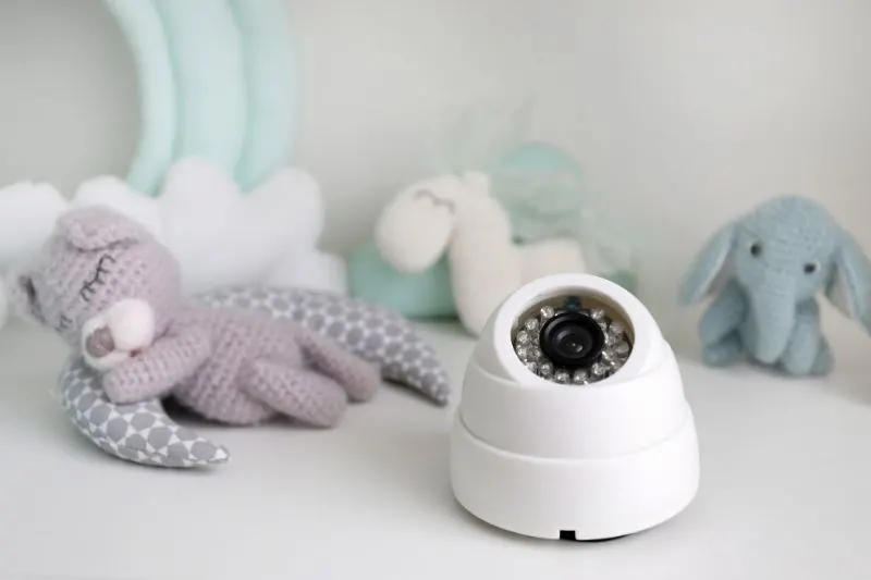 a baby monitor and toys on the table