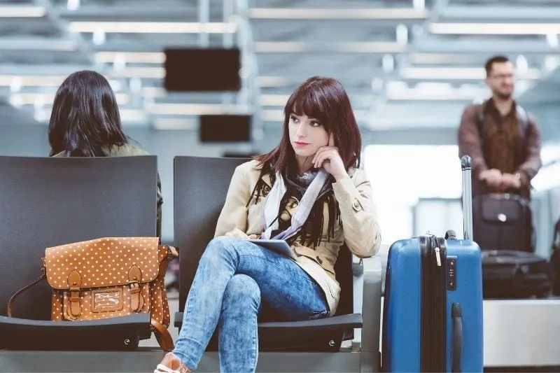 beautiful woman waiting at the airport for a delayed flight
