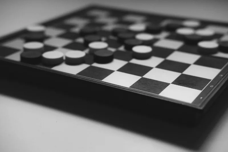 checkered board game on white table