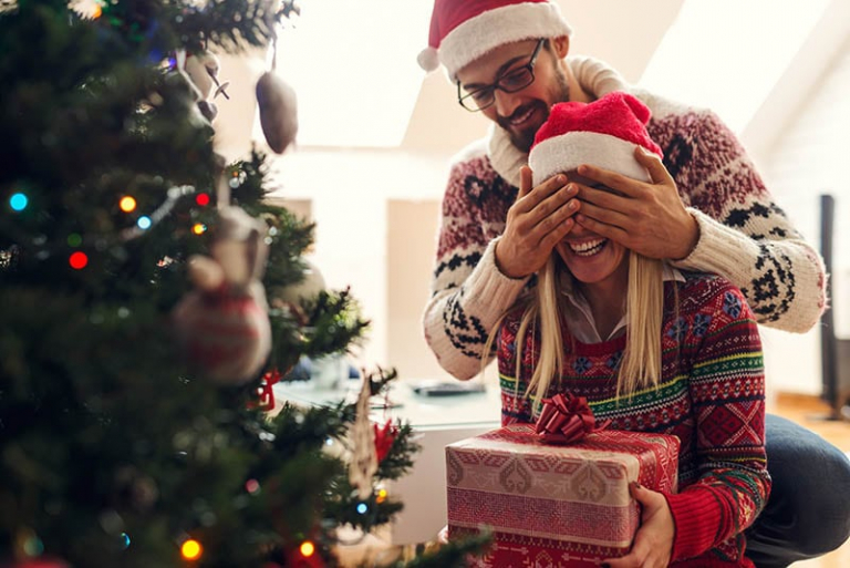boyfriend surprising girlfriend for Christmas