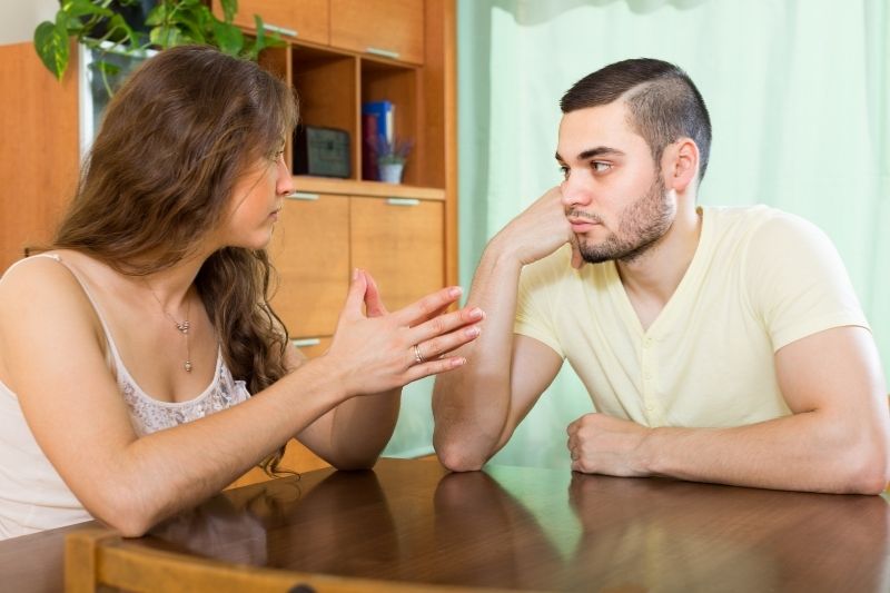 couple having serious talking by the dining table