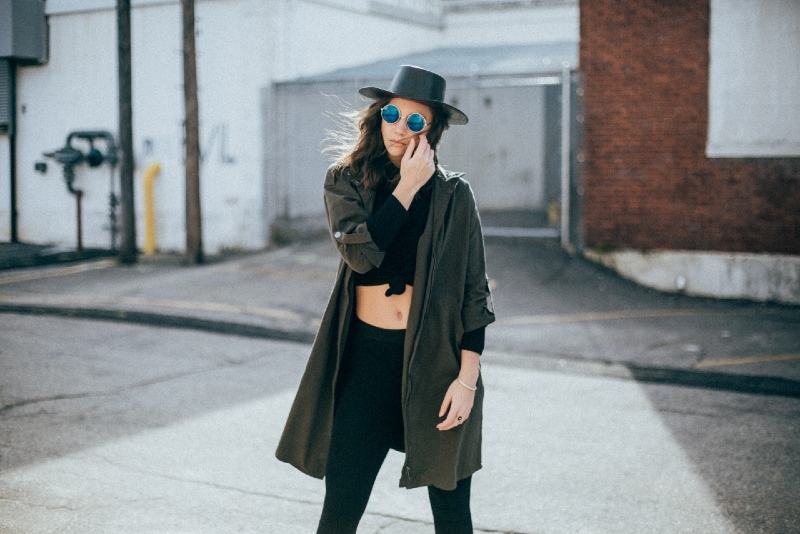 woman with black hat standing outdoor