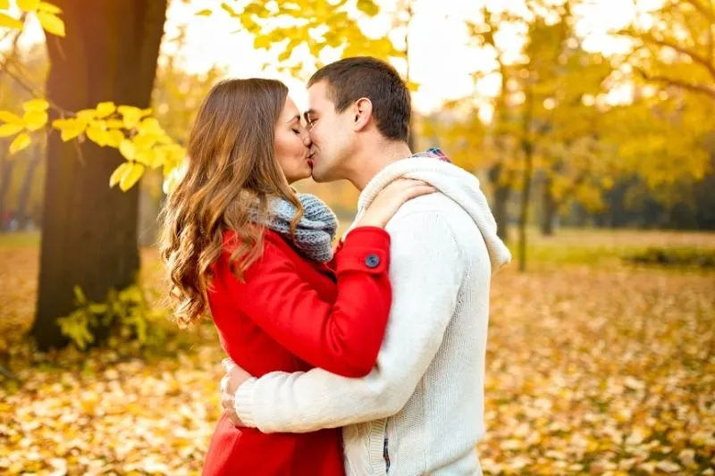 young love couple in the park during autumn season