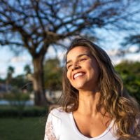 woman in white top smiling outdoor