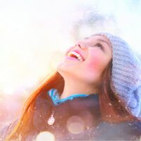 portrait of a smiling woman in the snow