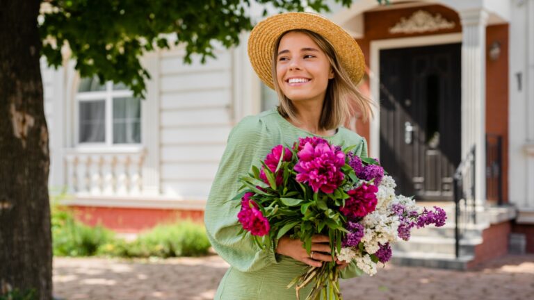 happy woman holding flowers