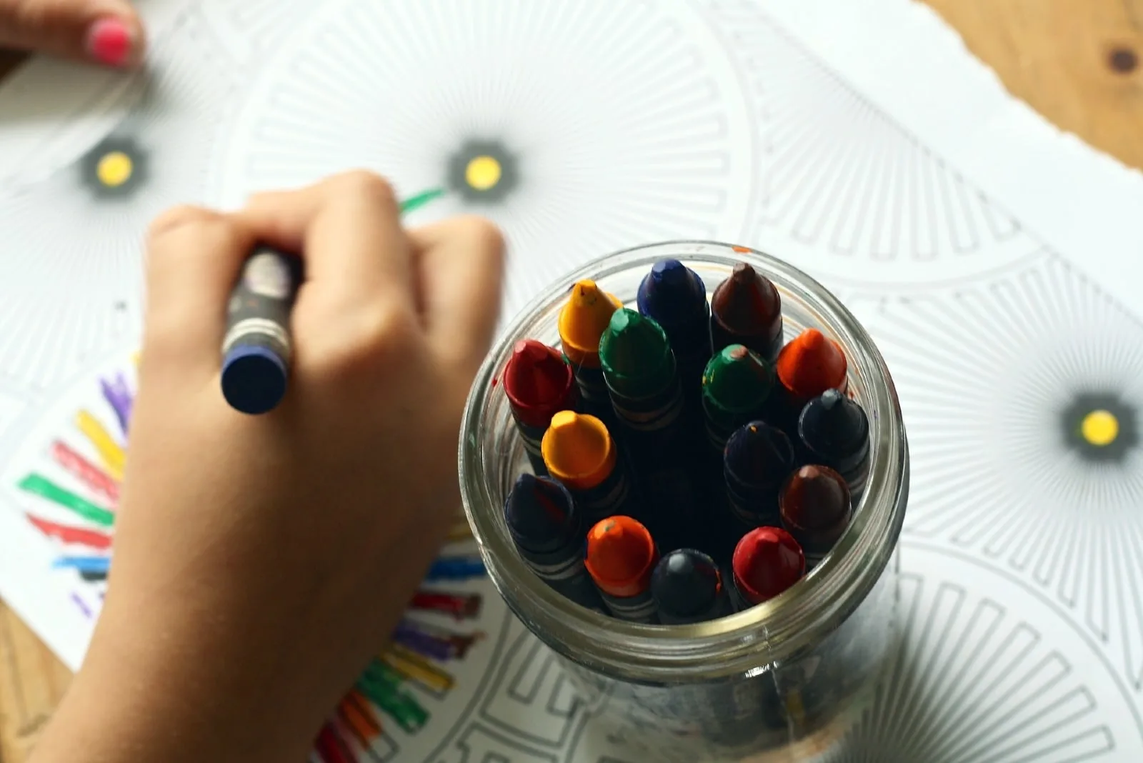 child coloring art with crayon