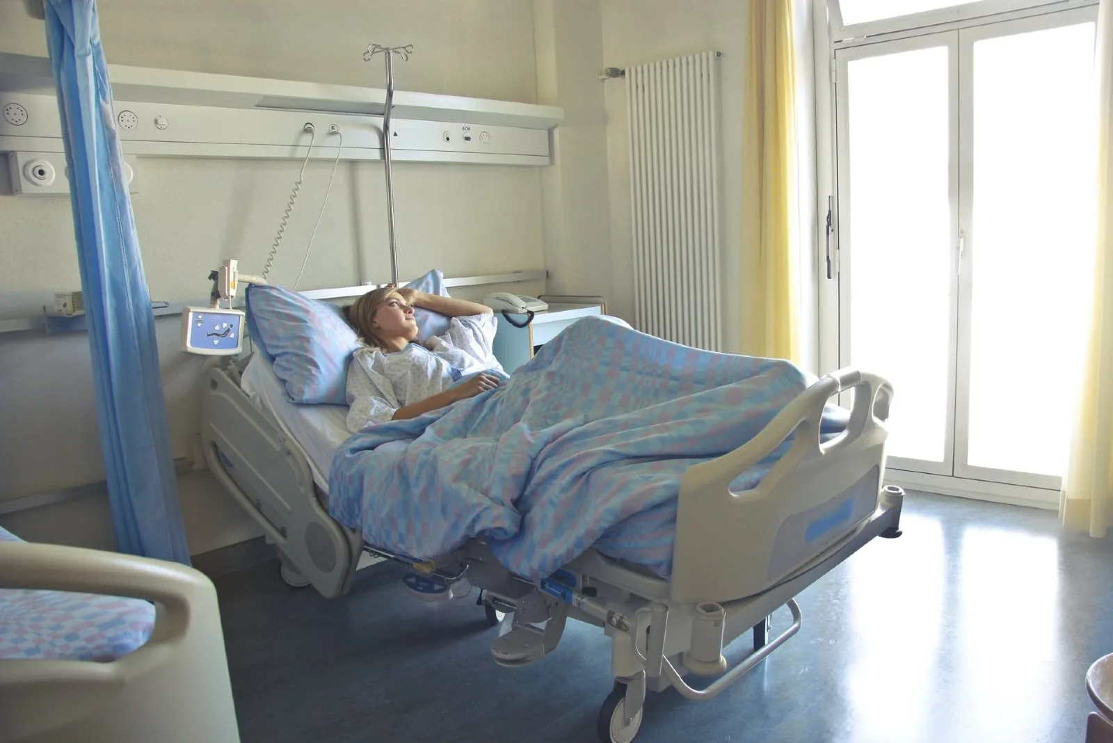 woman laying in hospital bed