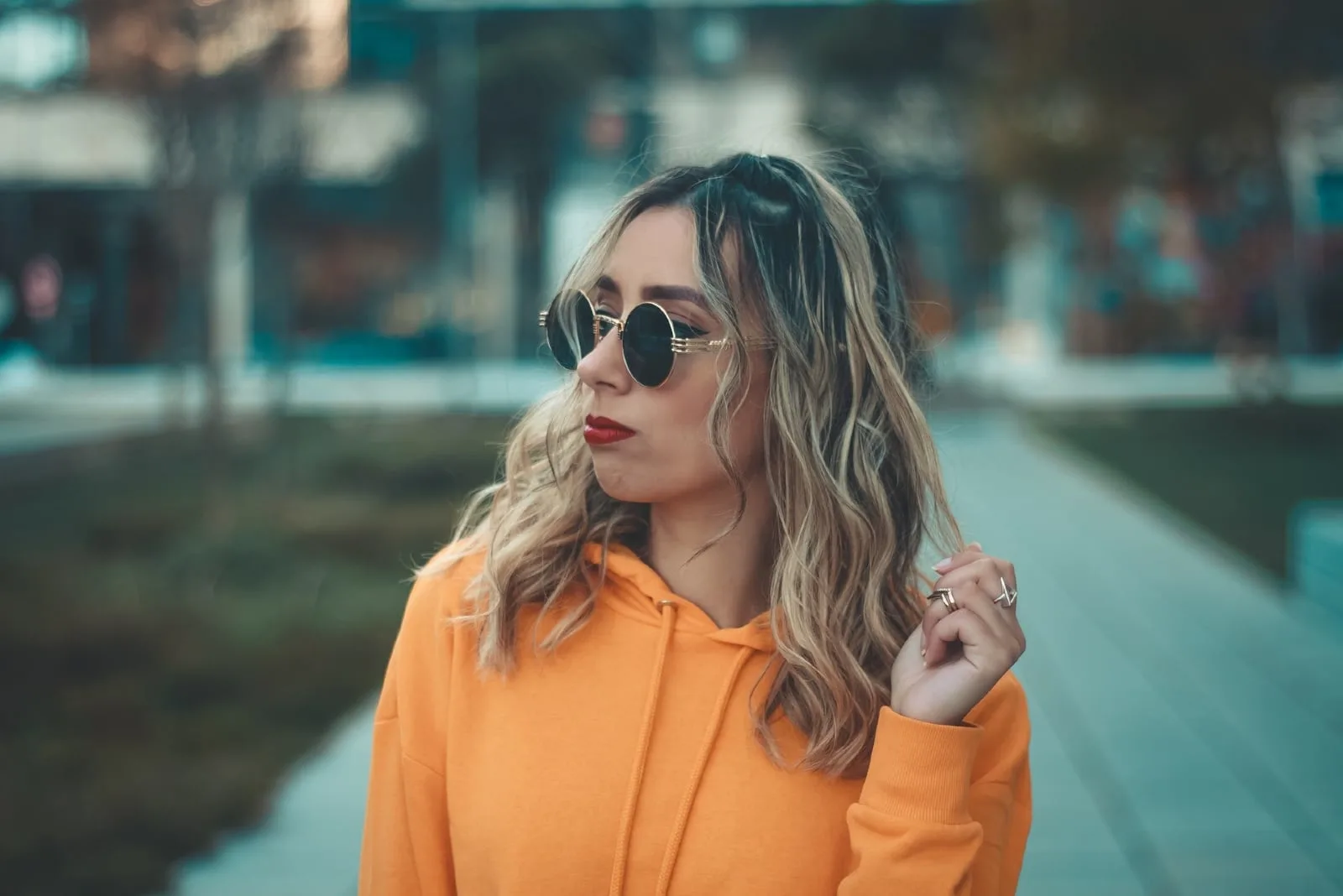 woman with sunglasses standing outdoor