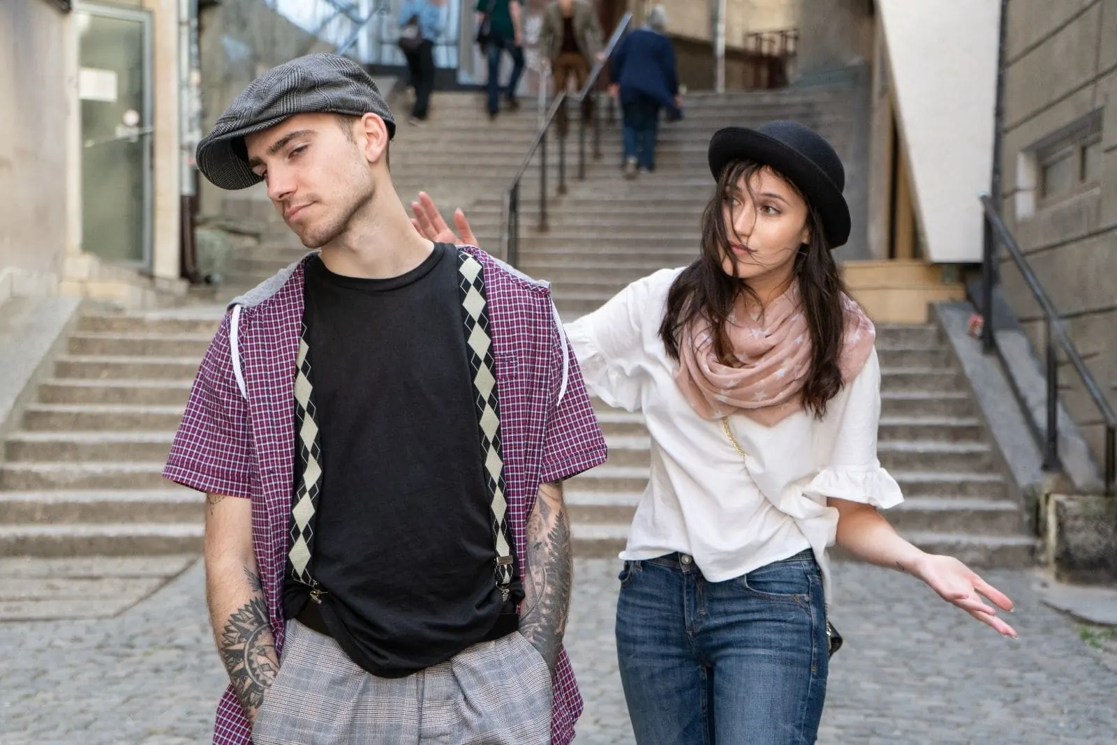 young couple walking in the city arguing or discussing