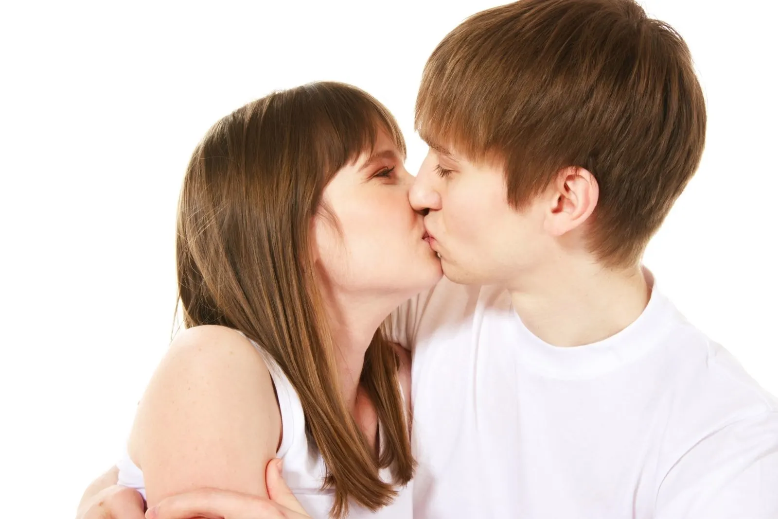 young loving kissing couple with a white background