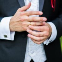 Close-up of elegance man hands with ring, and cufflink