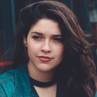 woman in denim jacket standing outdoor