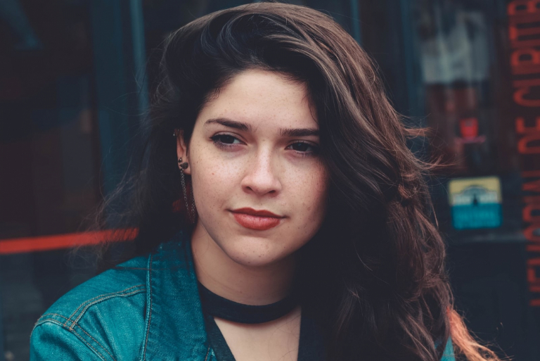 woman in denim jacket standing outdoor