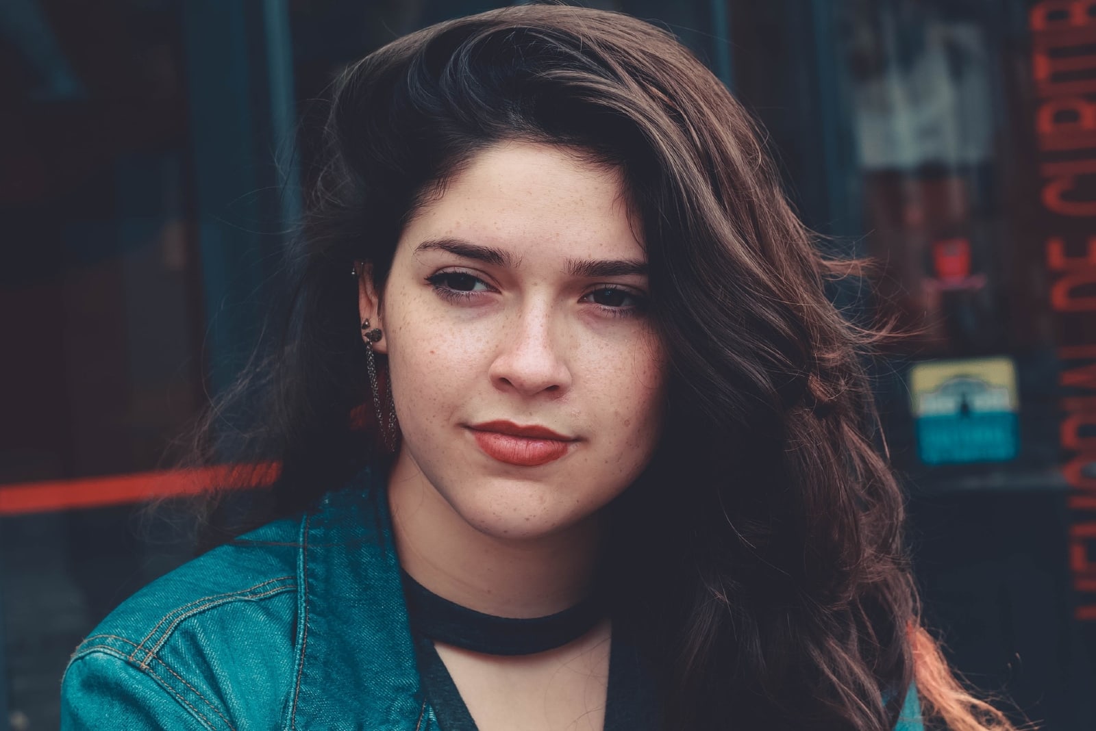 woman in denim jacket standing outdoor