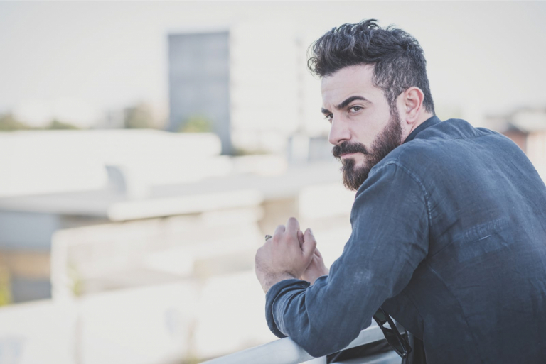 man with beard standing outdoor