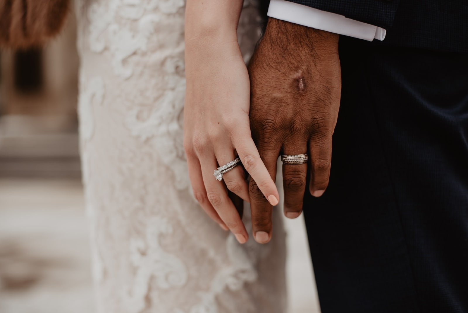 bride and groom holding hands outdoor