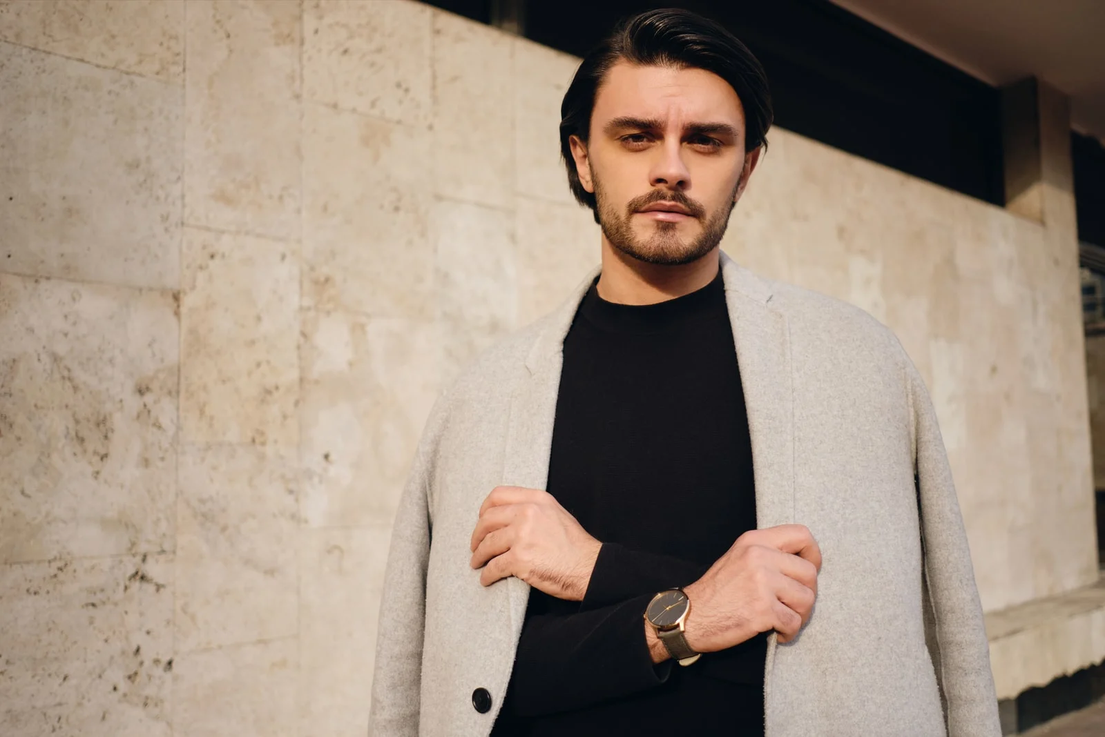 handsome stylish brunette man with coat 