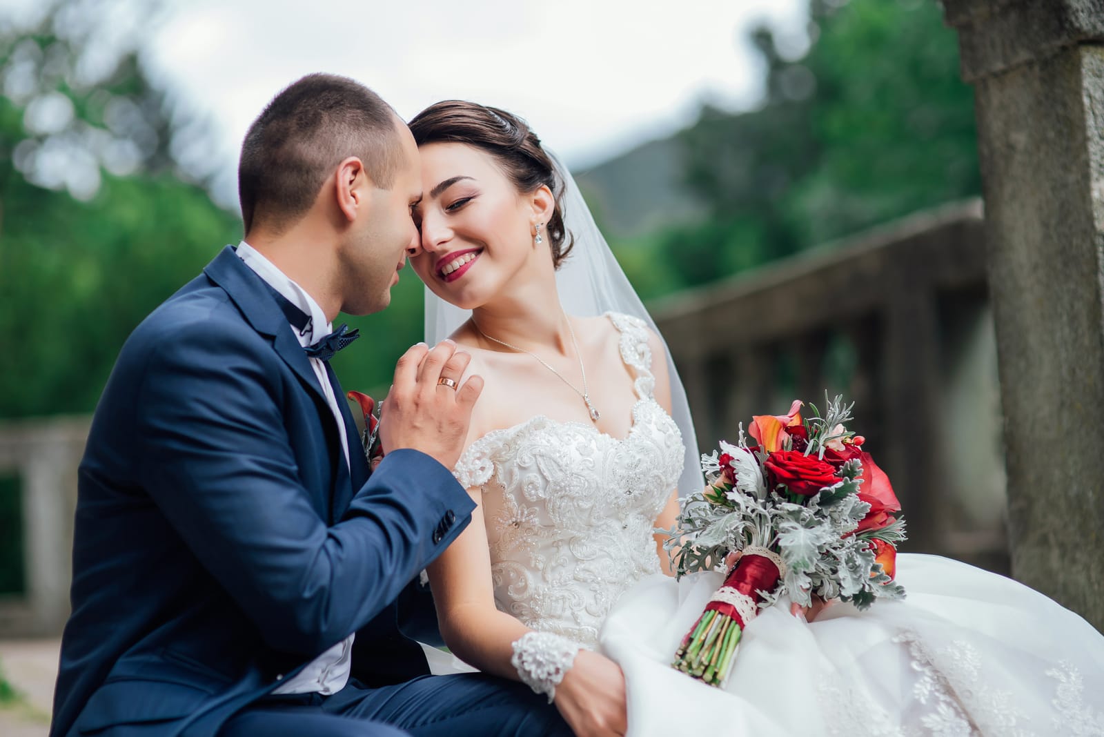 newlyweds pose on the stairs