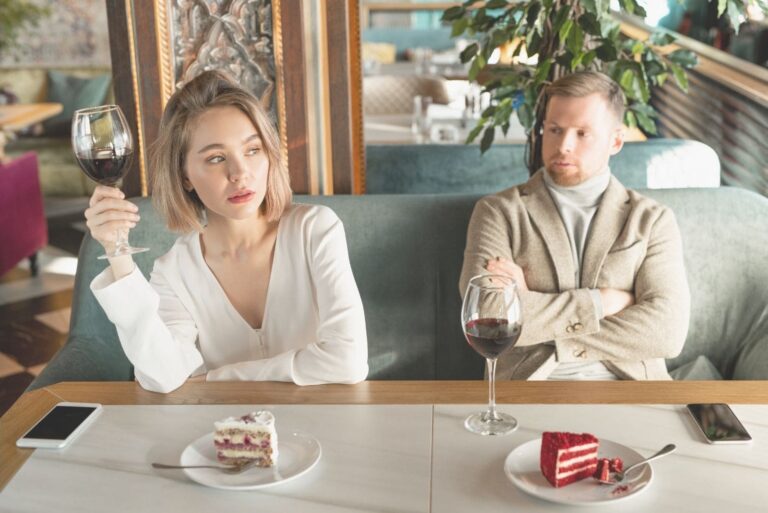 resentful woman talking to man while having a date at the restaurant in a horizontal shot