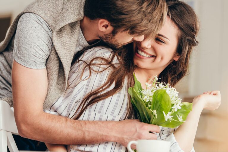 a man hugged a woman and bought her a bouquet of flowers