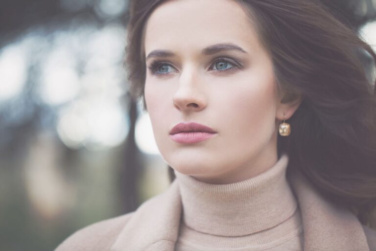 pensive beautiful woman looking at a distant in a focus photography outdoors