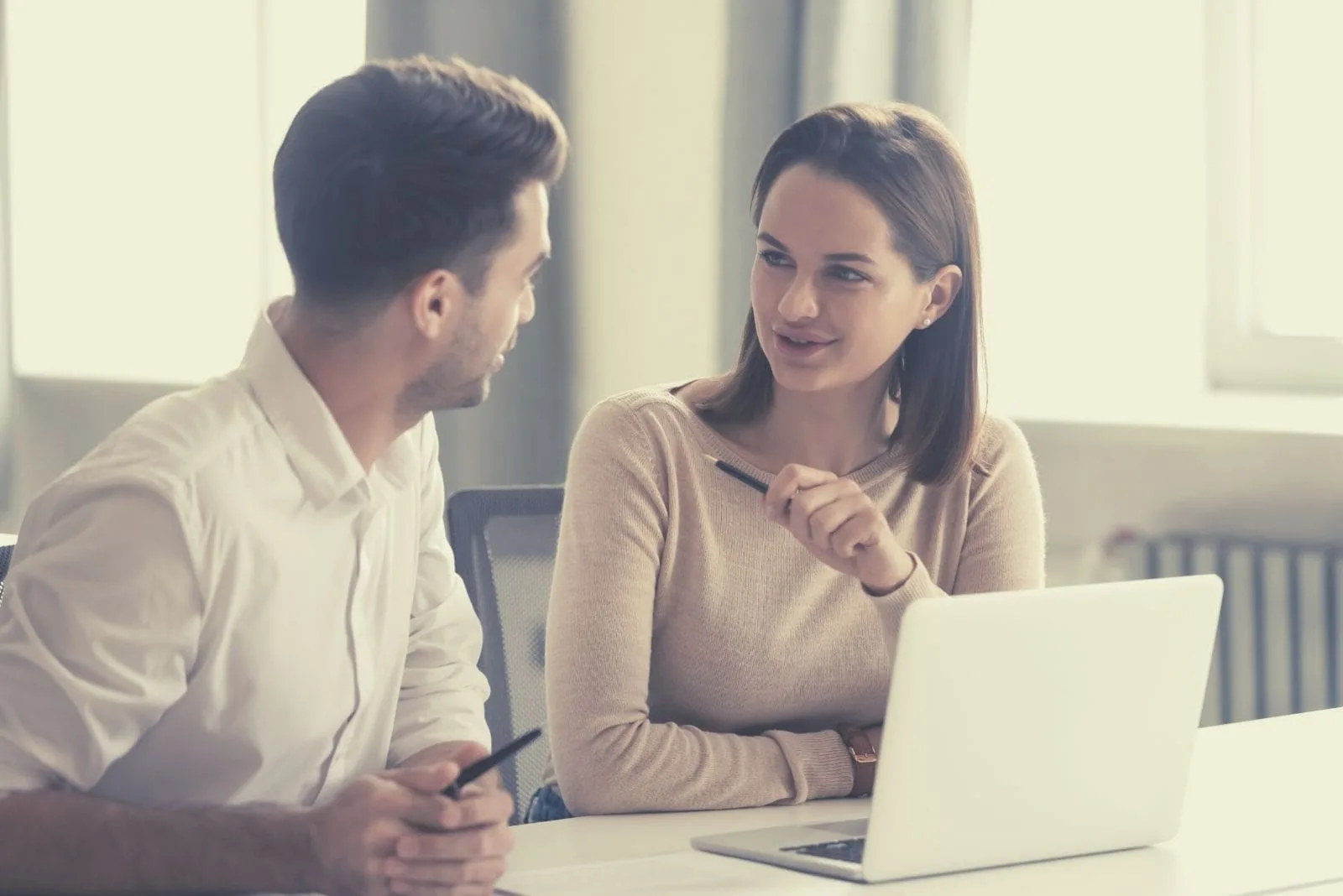creative male and female working in the office sharing ideas