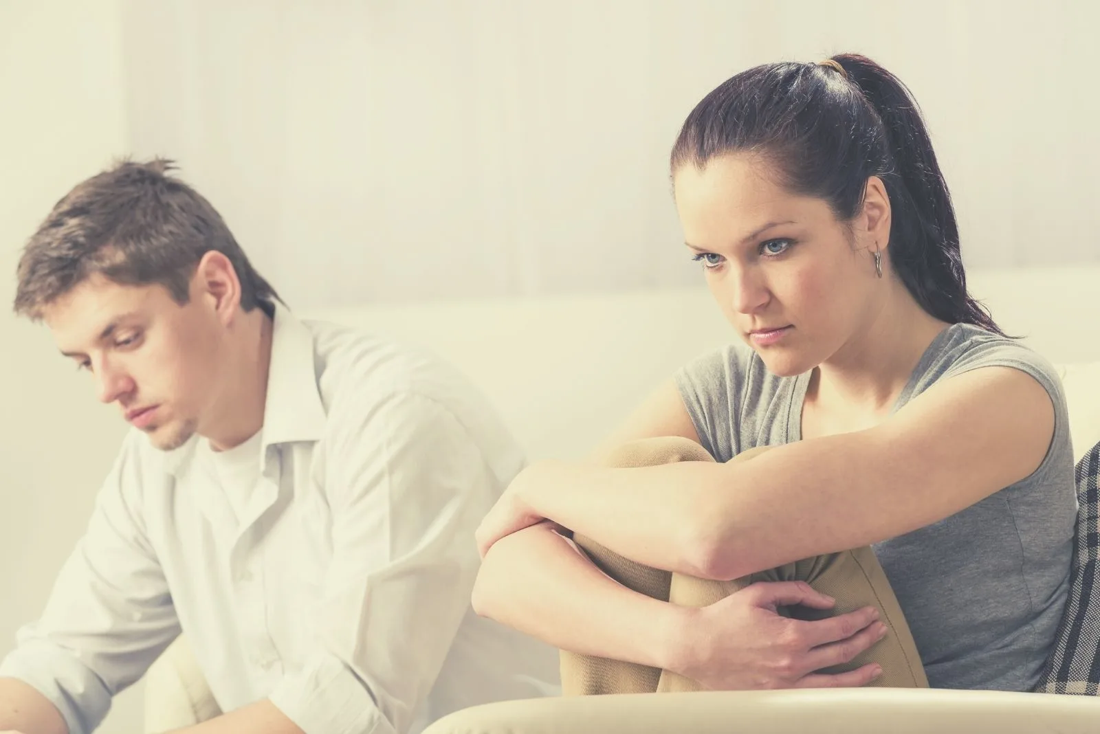 unhappy silent couple sitting in