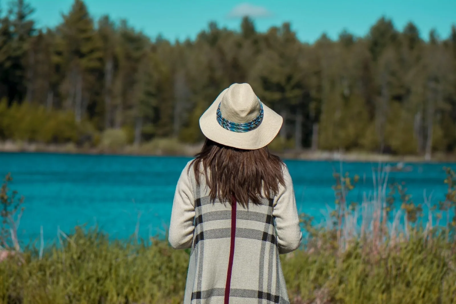 woman with hat looking at water