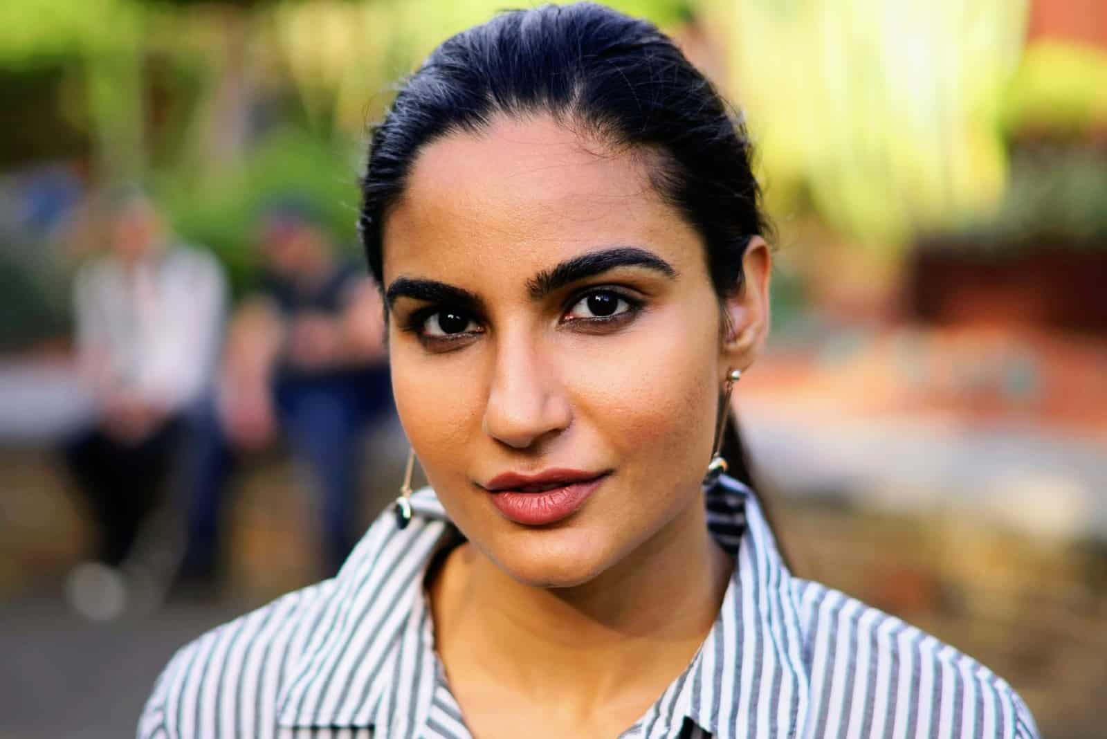 woman in striped shirt standing outdoor