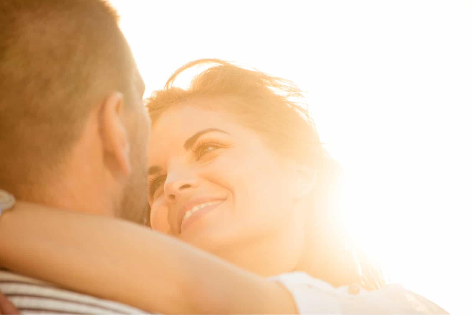 couple hugging during sunset