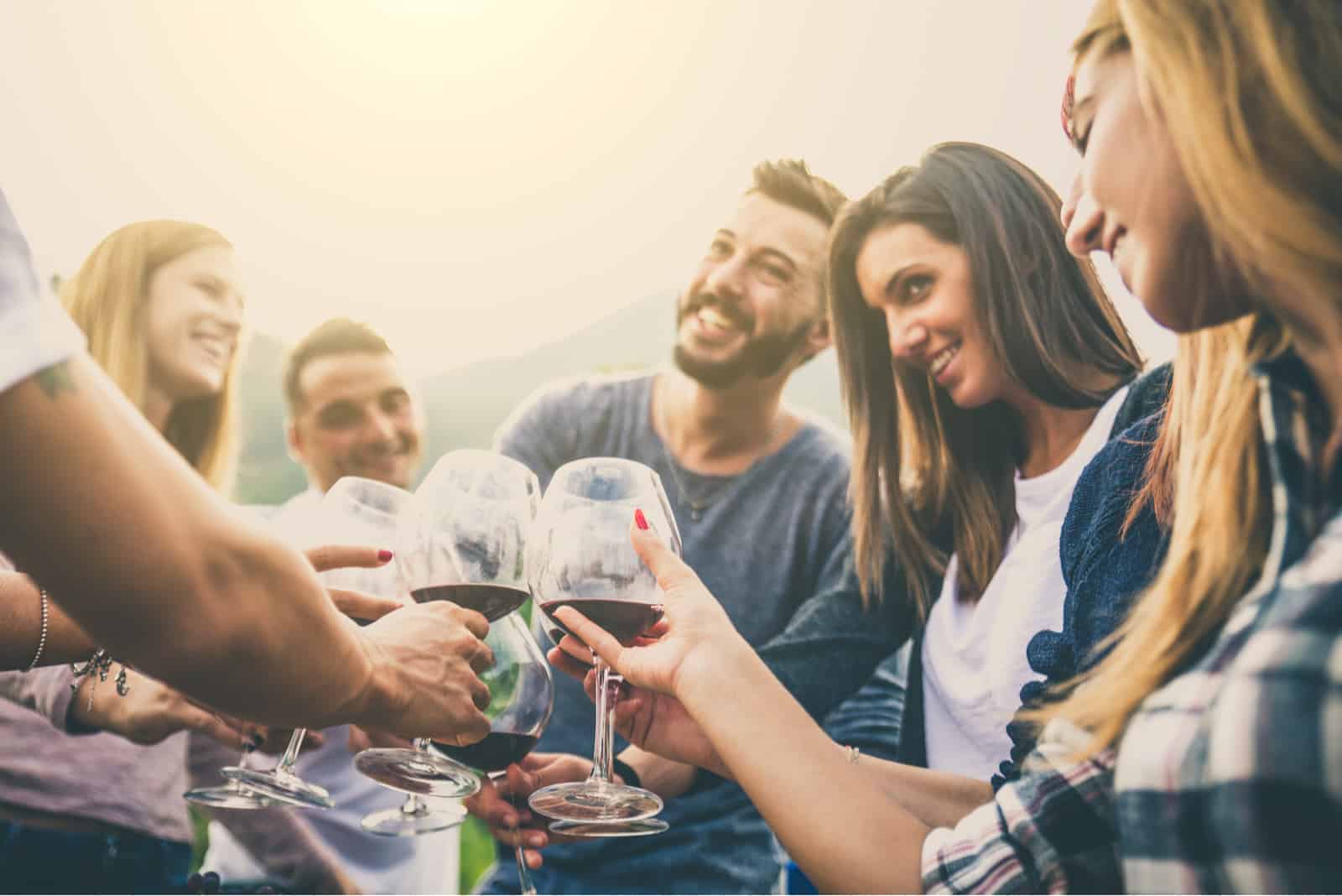 friends laugh while toasting