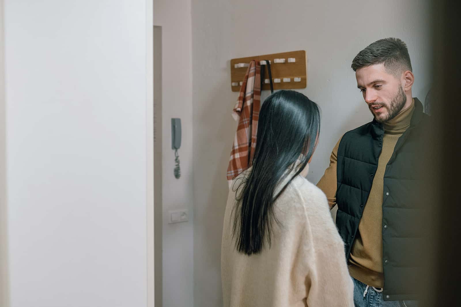 man flirting with a woman in an apartment