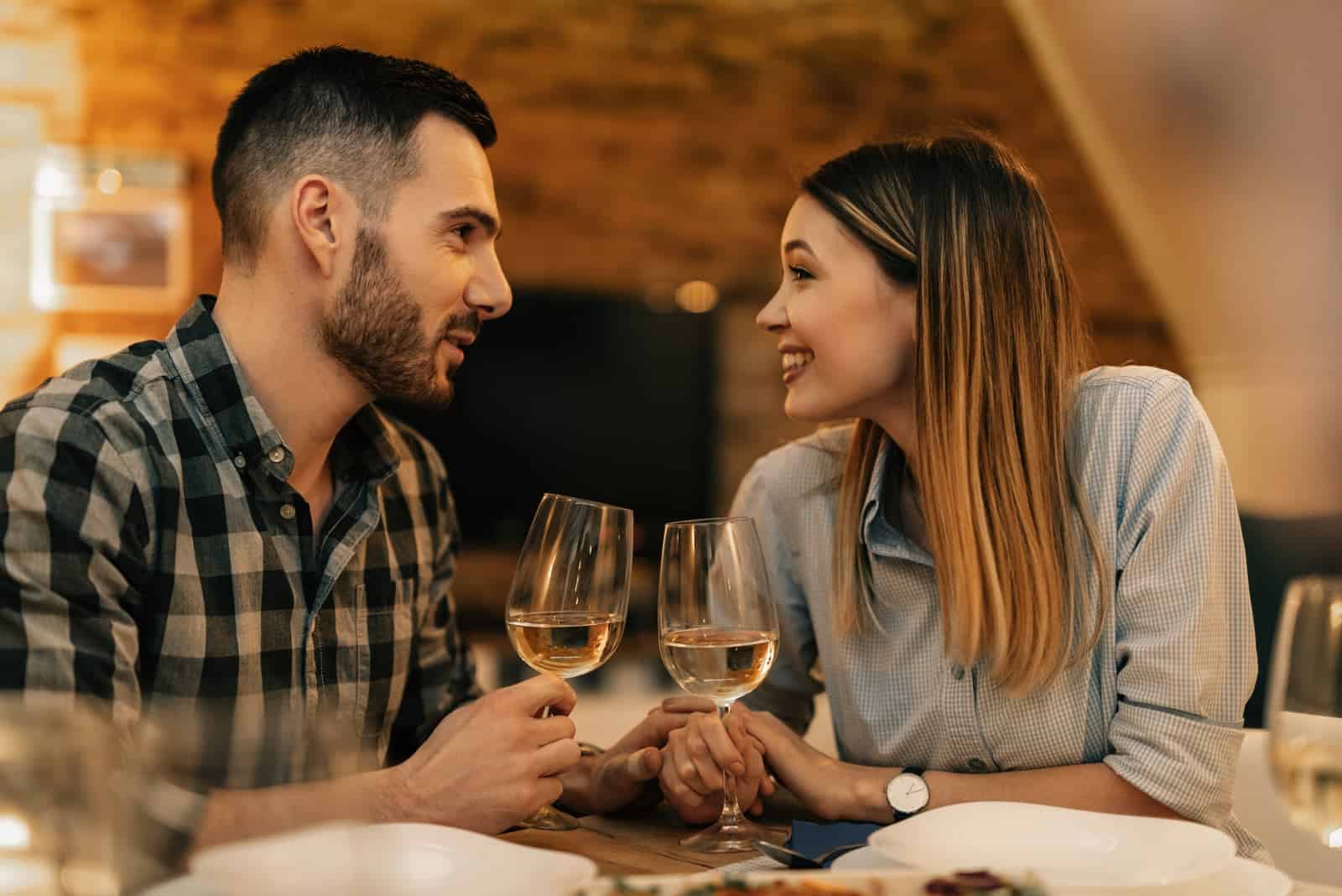 smiling couple talking at restaurant