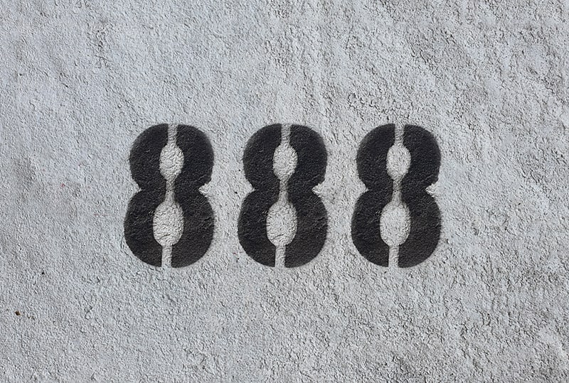 number 888 sprayed on gray wall
