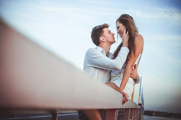 loving couple hugging on the bridge