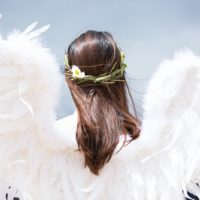 woman with white angel wings