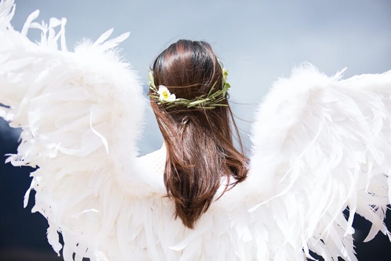 woman with white angel wings