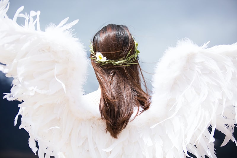 woman with white angel wings