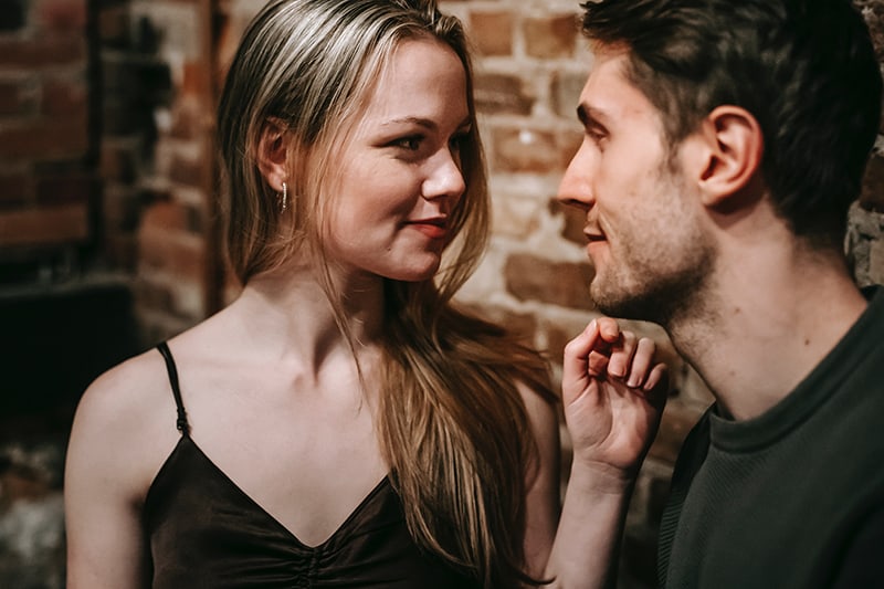 couple looking each other in eyes and flirting