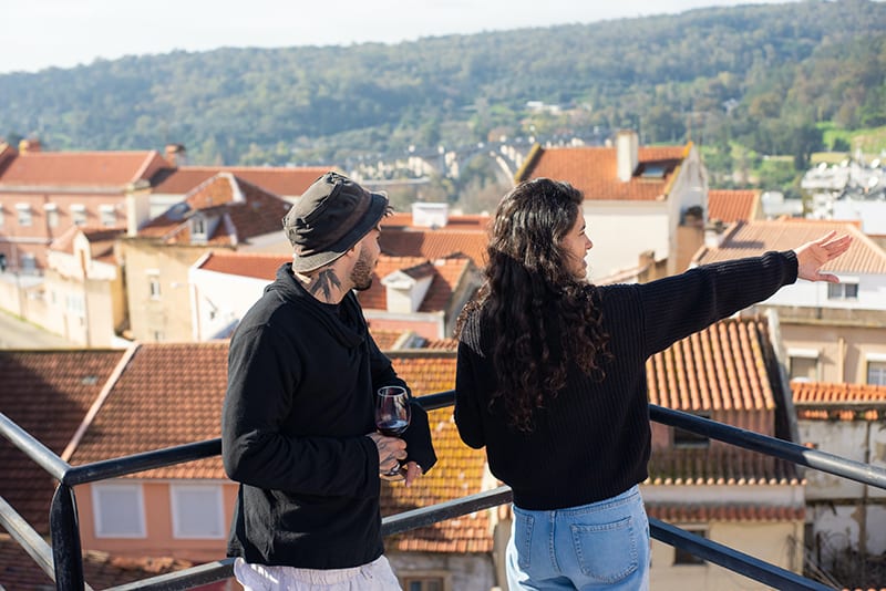 friends standing on the rooftop and talking