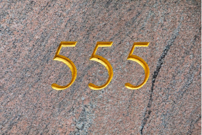 number 555 carved in gold