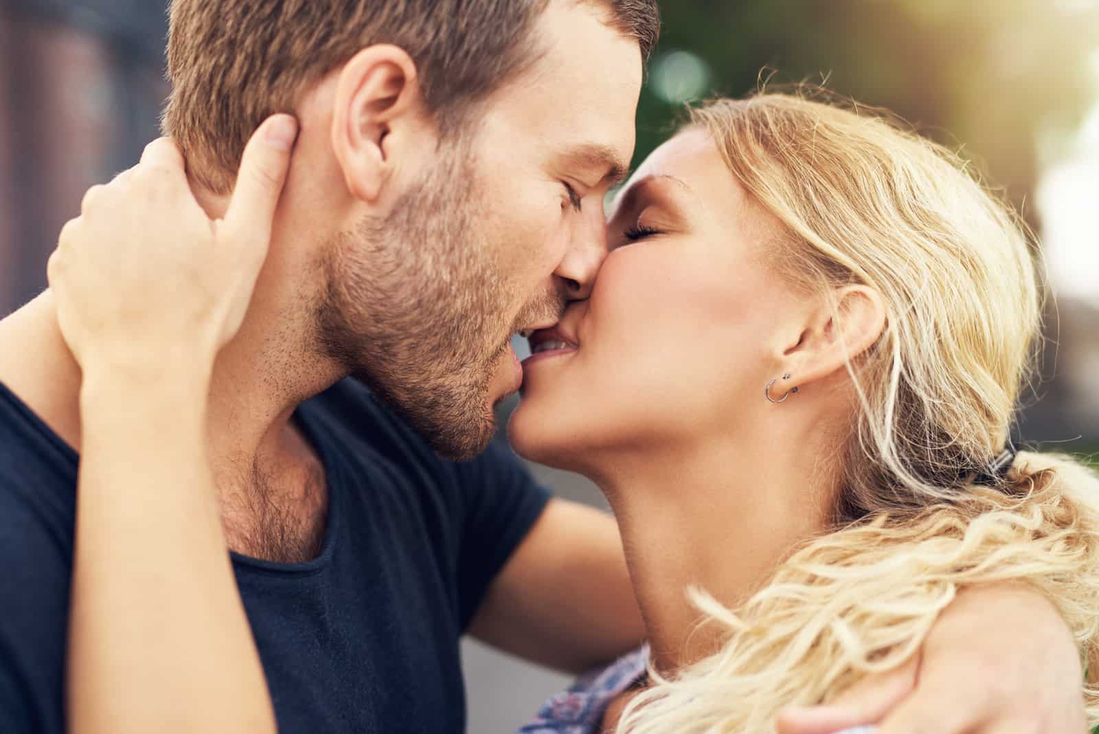 couple deeply in love sharing a romantic kiss,