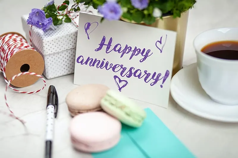 happy anniversary card on table