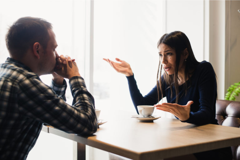 couple arguing at cafe