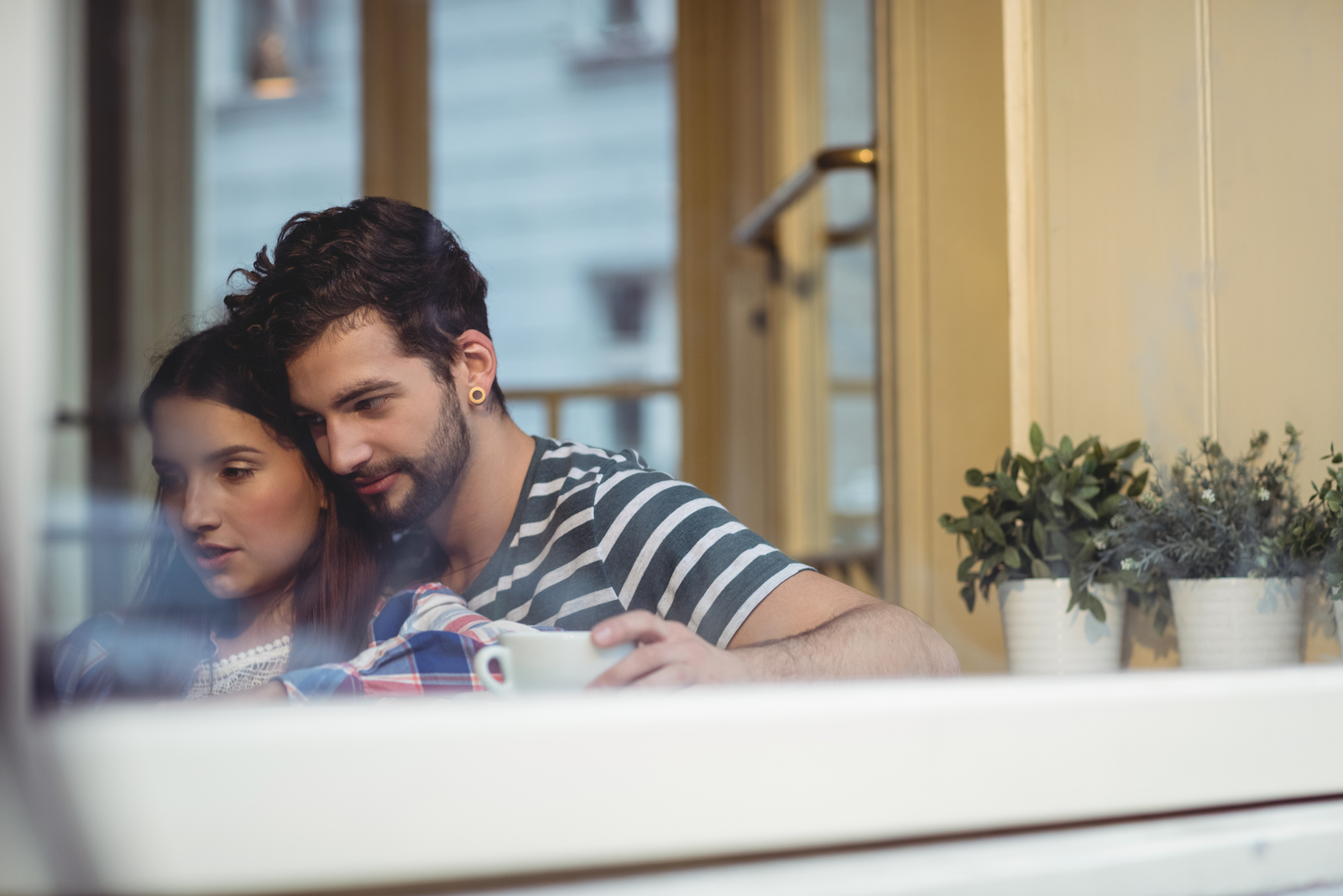 a woman in the arms of a man