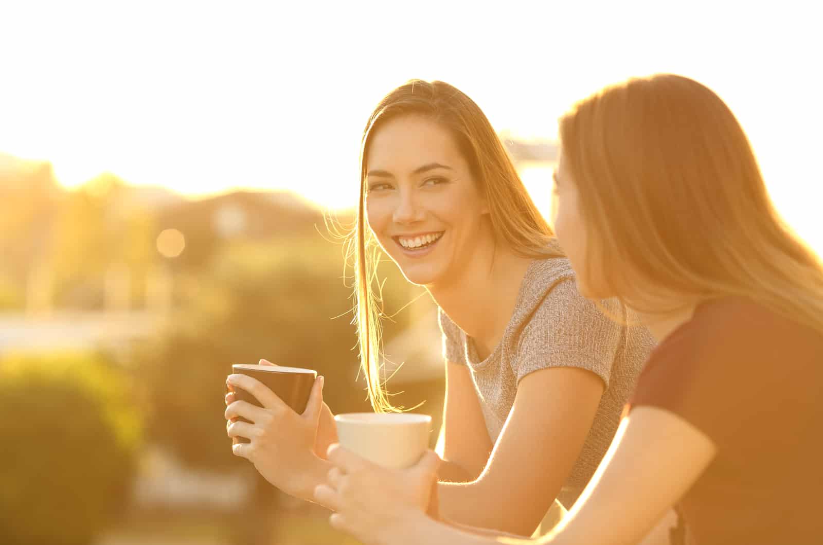 two girl friends laughing