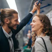 happy couple flirting in train