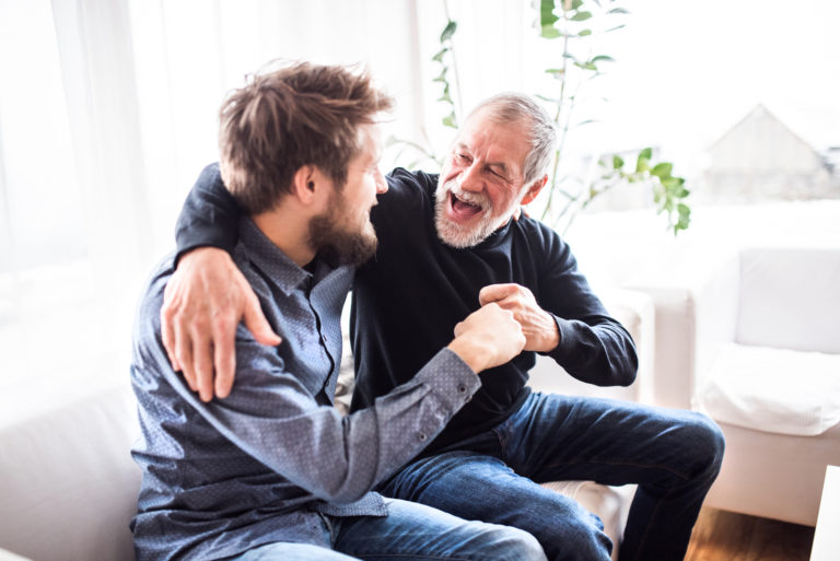 happy father and son hugging at home